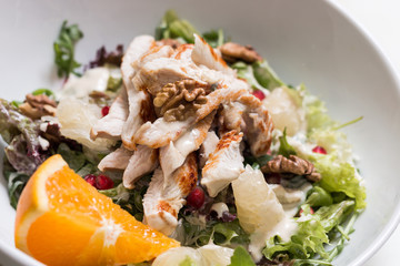 Turkey breast salad with walnut and pomelo