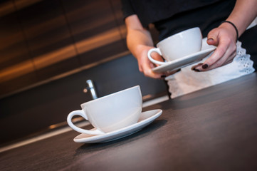 Waitress preparing coffee