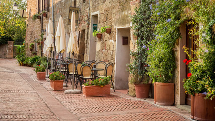 Fototapeta na wymiar Beautiful street decorated with flowers, Italy