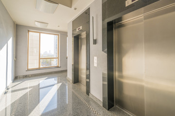 entrance of a residential building with an elevator