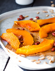 baked pumpkin slices with cinnamon and honey on parchment