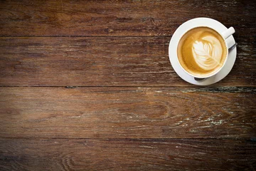 Foto op Plexiglas latte koffie op hout met ruimte. © tortoon