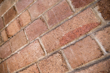 Shallow DOF perspective of weathered red bricks in Sydney, Austr