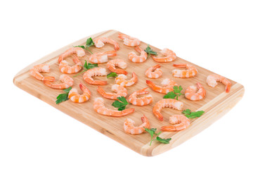 Boiled shrimps on cutting board.