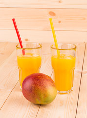 Mango and juice. Close up.