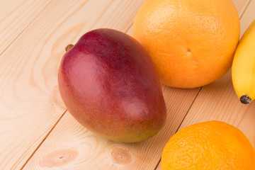 isolated ripe mango and citrus fruits
