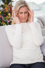 Blonde getting a headache on christmas day