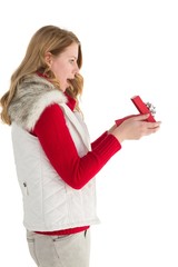 Naklejka premium Surprised blonde woman opening gift