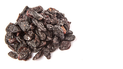 Black raisin over white background