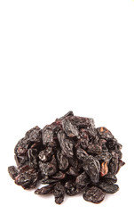 Black raisin over white background