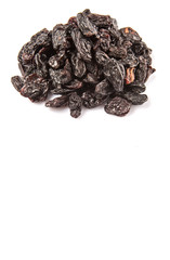 Black raisin over white background