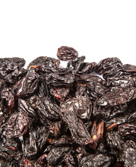 Black raisin over white background