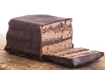 Sweet chocolate cake decorate with dark chocolate ship the image