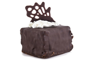 Sweet chocolate cake decorate with dark chocolate ship the image