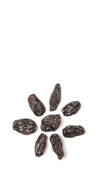 Black raisin over white background 