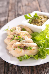 frog leg with parsley and salad