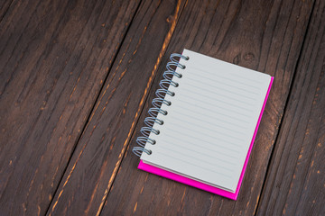 Note book on wooden background