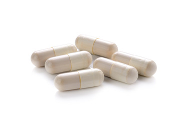Fototapeta na wymiar close up of pills capsule isolated on white background