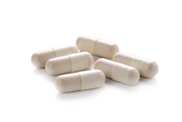 Foto auf Acrylglas close up of pills capsule isolated on white background © sommai