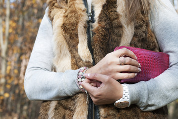 Women's hands holding the purse