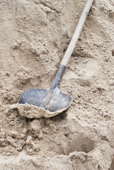 Shovel in a heap of sand