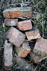 Old bricks heap on a grass