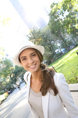 Trendy girl walking in Madison Square Park in Manhattan