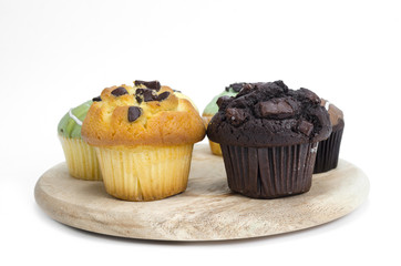 Chocolate muffin cake isolated on white