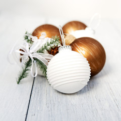 Obraz na płótnie Canvas Christmas balls on a white wooden background