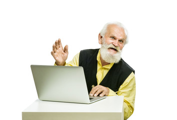 Old bearded man with laptop isolated