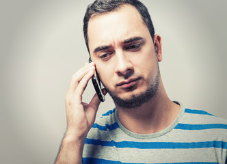 young man talking on the phone
