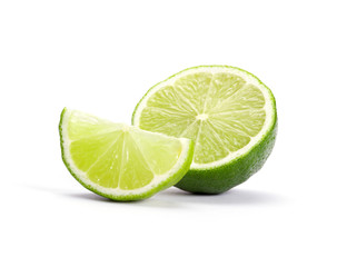 Limes with slices isolated on white background - 72665224