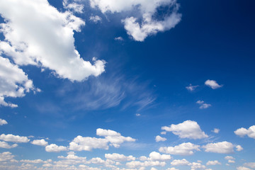 blue sky background with tiny clouds