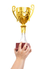 golden cup in hands