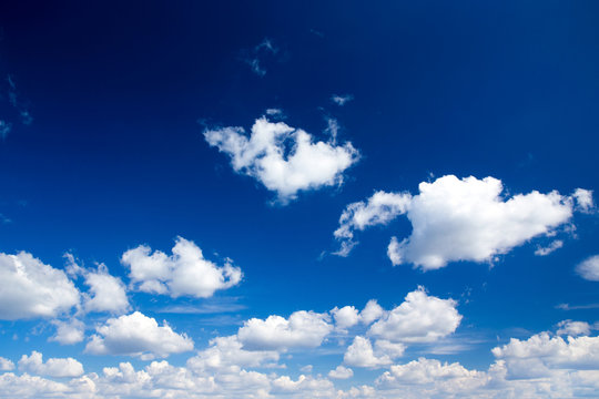 blue sky background with tiny clouds