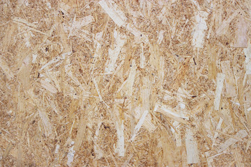background brown board of pressed small sharp splinters