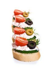 Canapes with Crab Cream, Cherry Tomatoes, Cucumber and Olives