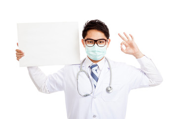 Asian male doctor wear mask show OK with blank banner