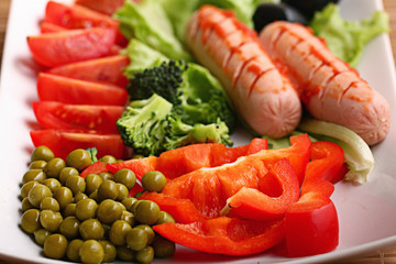 Breakfast sausages vegetables green peas