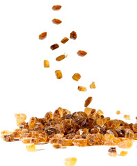 Slices of falling brown candy sugar