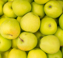 Bunch of green apples in supermarket.