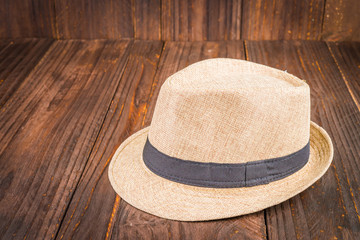 Beach hat on wooden background