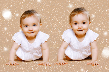 Christmas, children and people concept - two funny twins baby an