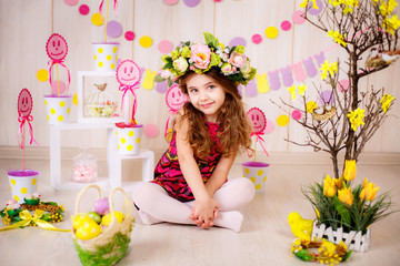 Fototapeta na wymiar Easter concept. Beautiful girl in the room with decorations