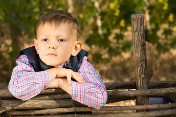 Thoughtful serious young boy