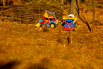 Colored Truck Toys on Brown Landscape