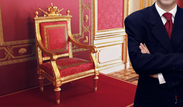 Man standing inside luxury royal palace interior