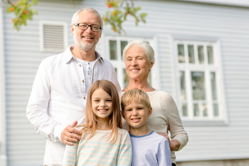 happy family in front of house outdoors