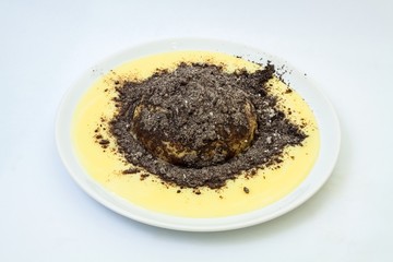 Fresh dumpling with vanilla sauce and poppy, white background