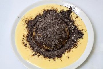 Fresh dumpling with vanilla sauce and poppy, white background